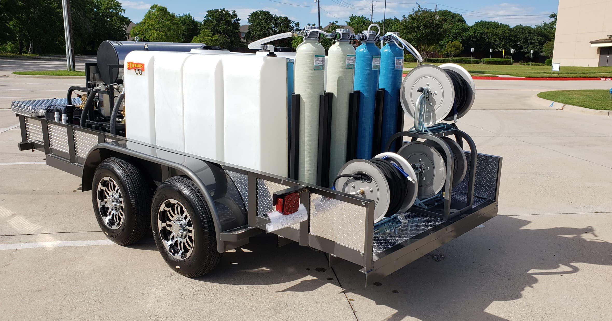Trailer mounted solar panel cleaning system